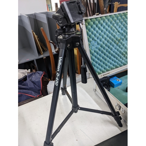 258 - A collection of photographic equipment to include a tripod, a Minolta 500 SI camera, Barska 10x25 wa... 