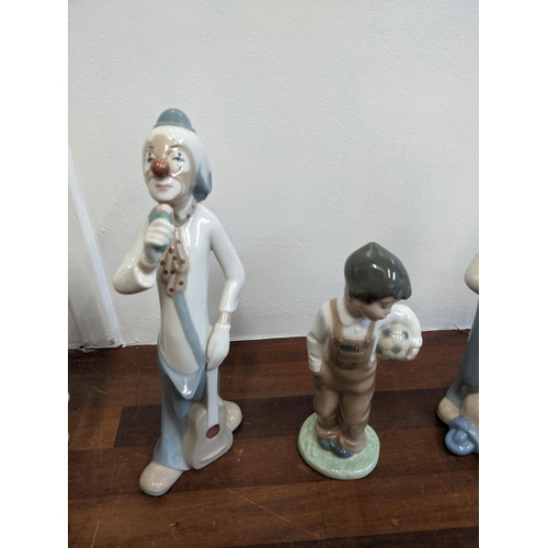 458 - Six porcelain figures to include Nao by Lladro 'Travelin' Man', three Casades clown figures, a Nao b... 