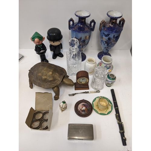 460 - A mixed lot of collectables to include a brass figure of a tortoise, a silver plated set of napkin r... 