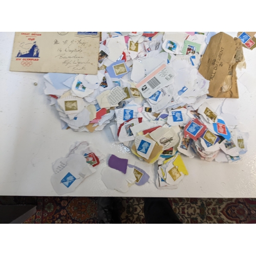 491 - A collection of used postage stamps together with a World stamp album, some commemorative coins and ... 