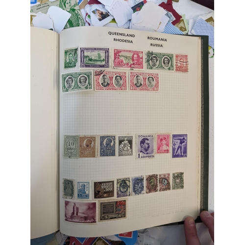 491 - A collection of used postage stamps together with a World stamp album, some commemorative coins and ... 