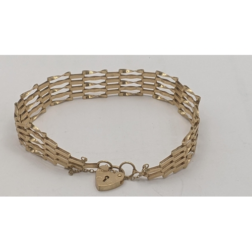 198 - A 9ct yellow gold gate link bracelet having a heart shaped padlock clasp, 5.6g Location: C6
If there... 