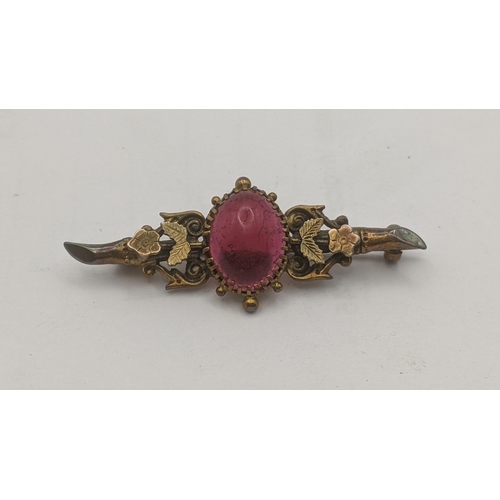 205 - A Victorian 9ct yellow gold bar brooch set with a red cabochon 3.1g Location: C6
If there is no cond... 