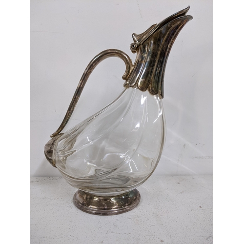 211 - A pair of oil lamps with clear reservoirs and white  glass shades, along with a silver plated decant... 