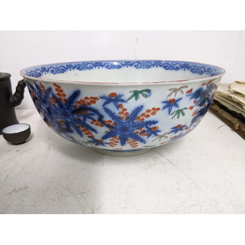 312 - A group of Chinese and Japanese ceramics to include a Chinese export famille rose punch bowl A/F, an... 