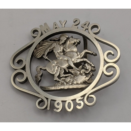 385 - A white metal St George and the Dragon, made into part of a belt buckle inscribed May 24 1905 Locati... 