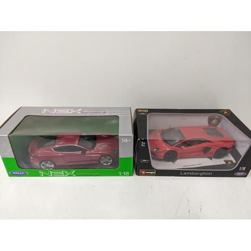 447 - Two boxed Diecast 1/18 scale model vehicles to include a Welly Nex models series Aston Martin DB9 Co... 