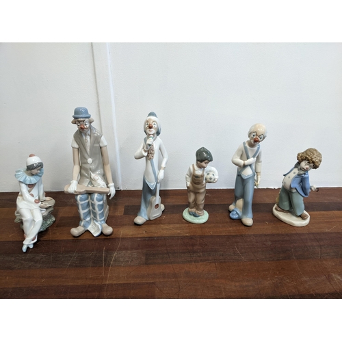 458 - Six porcelain figures to include Nao by Lladro 'Travelin' Man', three Casades clown figures, a Nao b... 