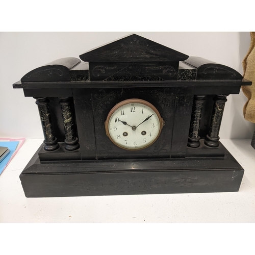 459 - A Victorian slate mantel clock with architectural design, with an Arabic dial
Location: LAB
If there... 