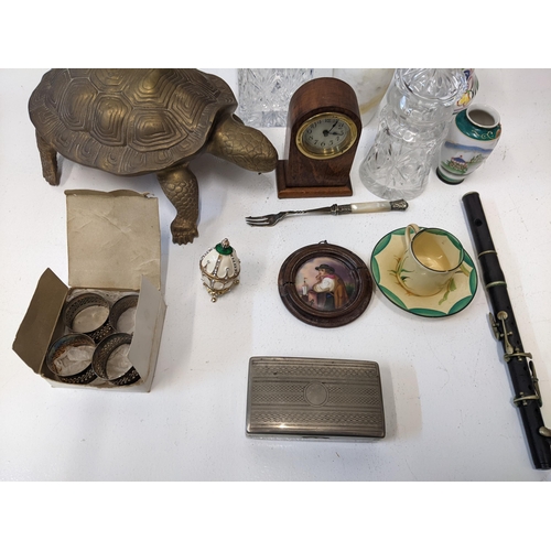 460 - A mixed lot of collectables to include a brass figure of a tortoise, a silver plated set of napkin r... 