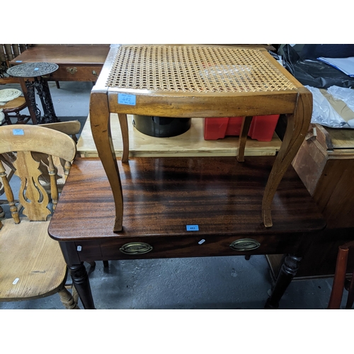 482 - A reproduction mahogany single drawer side table, on ring turned legs, an early 20th century cane se... 