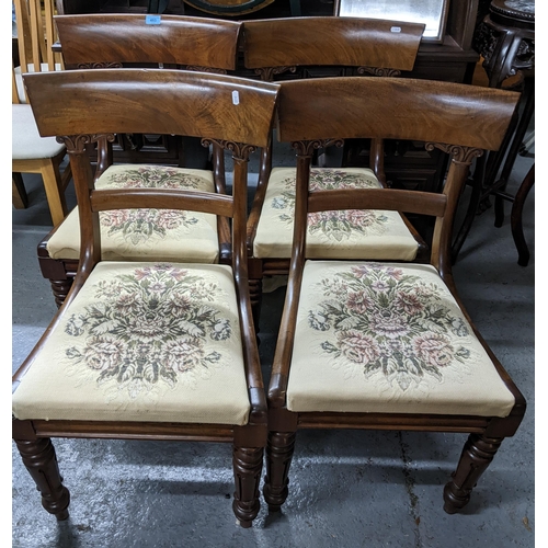 483 - A set of four William IV mahogany bar back dining chairs, tapestry upholstered drop in seats, on tur... 