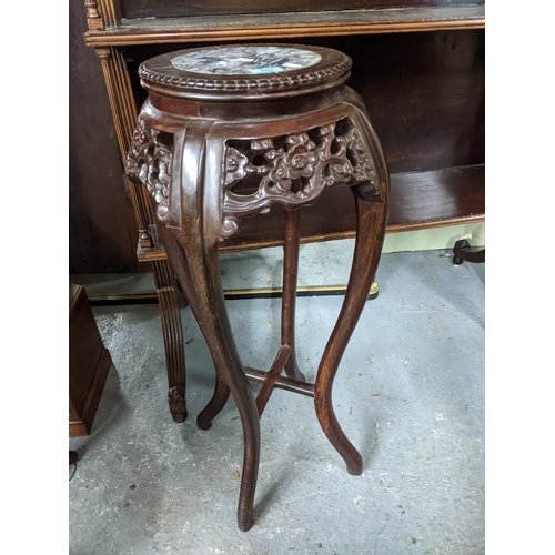 486 - A Chinese carved hardwood jardiniere stand with inset marble top, pierced prunus blossom decoration,... 