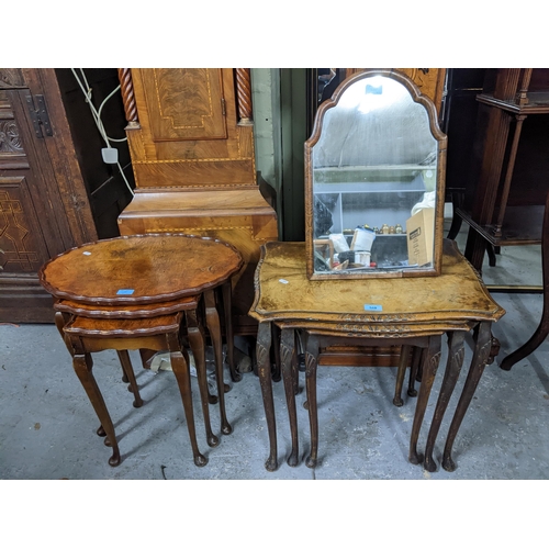 568 - Two early 20th century walnut veneered nests of three tables and a walnut framed strut dressing tabl... 