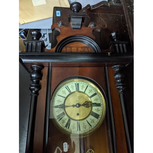 572 - An early 20th century mahogany and ebonised cased regulator wall clock, with cream enamelled and gil... 