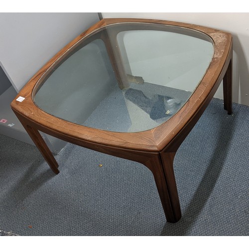 474 - A mid 20th century G-Plan teak coffee table having a circular glass inset top
Location: LAM
If there... 