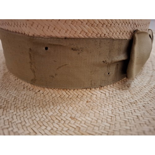 17 - Prada- A red, navy and cream straw belt with brown leather buckle and branded dust bag together with... 