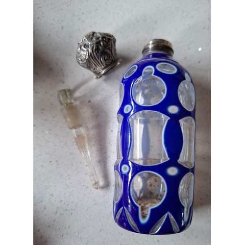 40 - A quantity of decorative scent bottles to include a Victorian white metal and glass example with blu... 