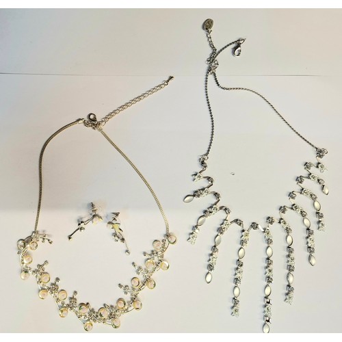 54 - A quantity of mainly modern silver costume jewellery to include earrings, fine chains and bangles. L... 