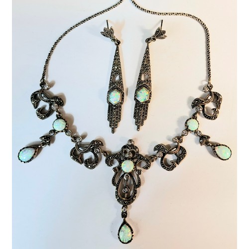 55 - A 20th Century silver and marcasite jewellery suite comprising a necklace and earrings in the Art De... 