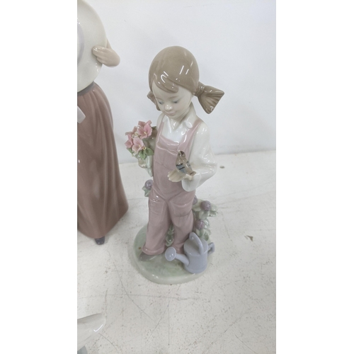 18 - A selection of Lladro figurines and models to include '5007 Bashful Girl with Straw Hat', a geese gr... 