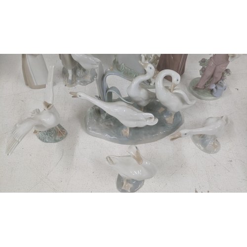 18 - A selection of Lladro figurines and models to include '5007 Bashful Girl with Straw Hat', a geese gr... 