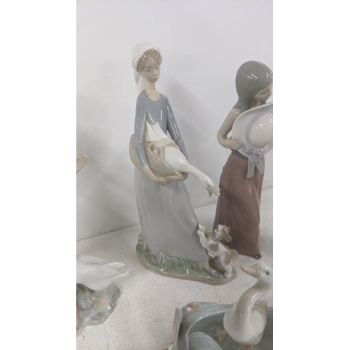 18 - A selection of Lladro figurines and models to include '5007 Bashful Girl with Straw Hat', a geese gr... 