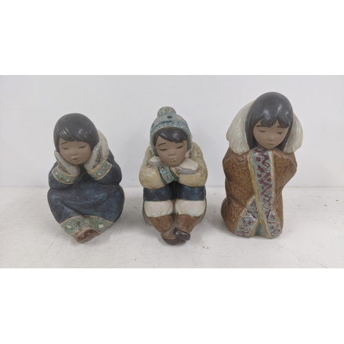 2 - Three Lladro figures to include 2156 Arctic Winter, 2159 Pensive Eskimo Boy and one other, all signe... 