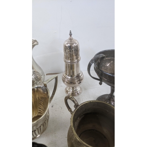 24 - A selection of silver plated items to include a Mappin & Webb coffee pot having floral engraved deco... 