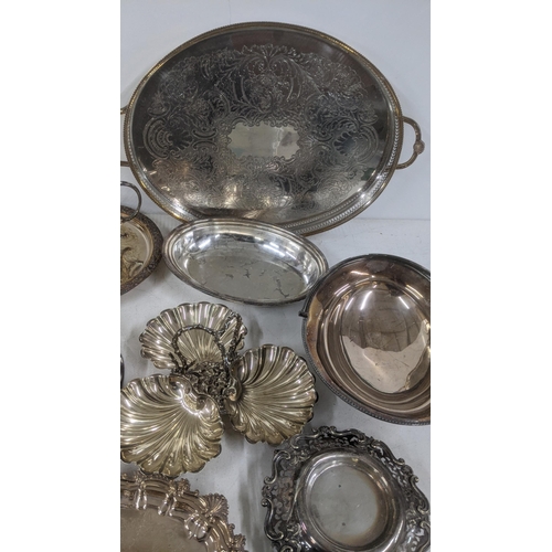 25 - A selection of silver plated and other tableware to include oval entrée dishes, a pedestal dish, twi... 