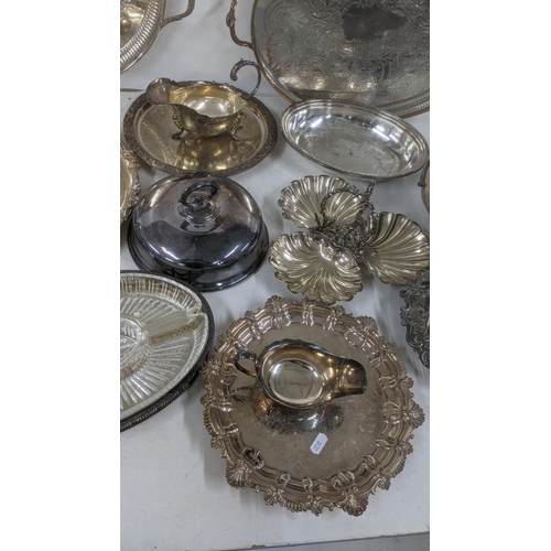 25 - A selection of silver plated and other tableware to include oval entrée dishes, a pedestal dish, twi... 