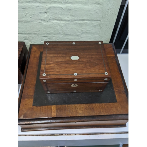 37 - A group of four vintage boxes to include a mahogany tea caddy with mother of pearl inlay, a walnut t... 