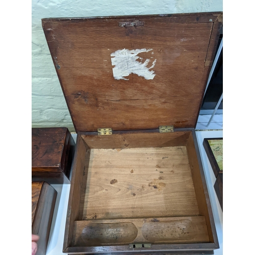 37 - A group of four vintage boxes to include a mahogany tea caddy with mother of pearl inlay, a walnut t... 