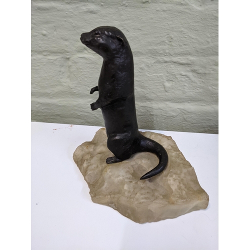 38 - A bronze sculpture of an otter on an onyx style plinth Location: 6.2
If there is no condition report... 