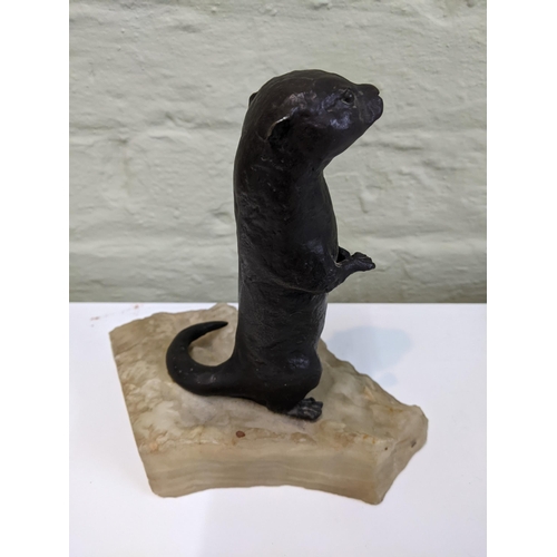 38 - A bronze sculpture of an otter on an onyx style plinth Location: 6.2
If there is no condition report... 