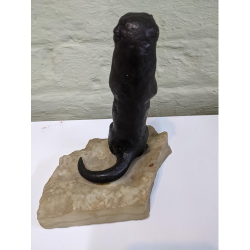 38 - A bronze sculpture of an otter on an onyx style plinth Location: 6.2
If there is no condition report... 