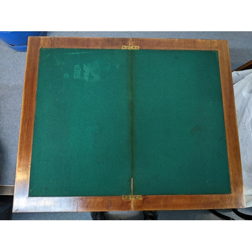 40 - An early 20th century fold top card table 75cm x 61cm unfolded Location: A2F
If there is no conditio... 