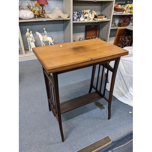 40 - An early 20th century fold top card table 75cm x 61cm unfolded Location: A2F
If there is no conditio... 