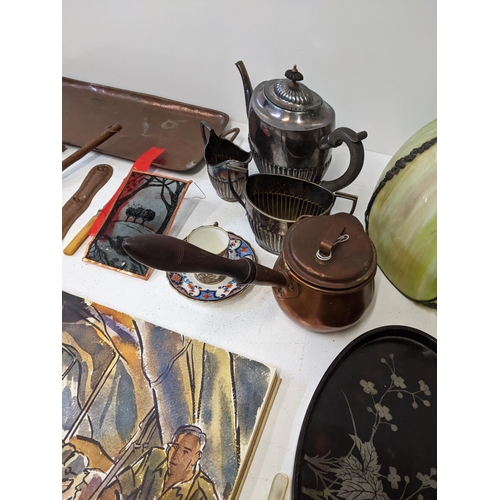 43 - A mixed lot to include a silver plated teapot, milk jug and sugar bowl, a twin handled rectangular c... 