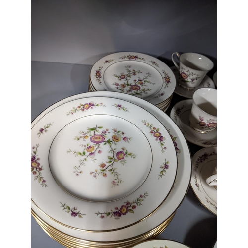 44 - A Noritake 'Asian Song' pattern part dinner service to include plates, side plates teacups and sauce... 