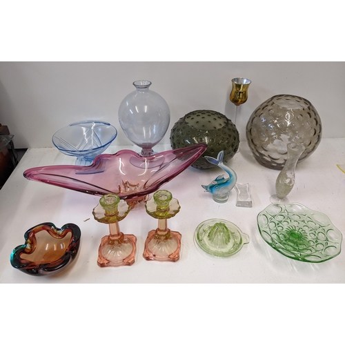 50 - A collection of 20th century art glass to include a pair of Uranium glass topped candlesticks, an or... 