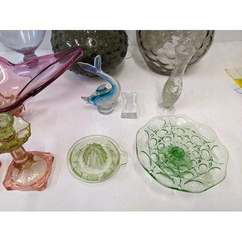 50 - A collection of 20th century art glass to include a pair of Uranium glass topped candlesticks, an or... 