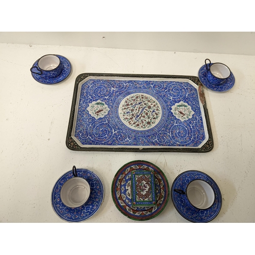 57 - An Islamic blue, white and red enamelled miniature tea set, matchbox holder and dish
Location: 1.3
I... 