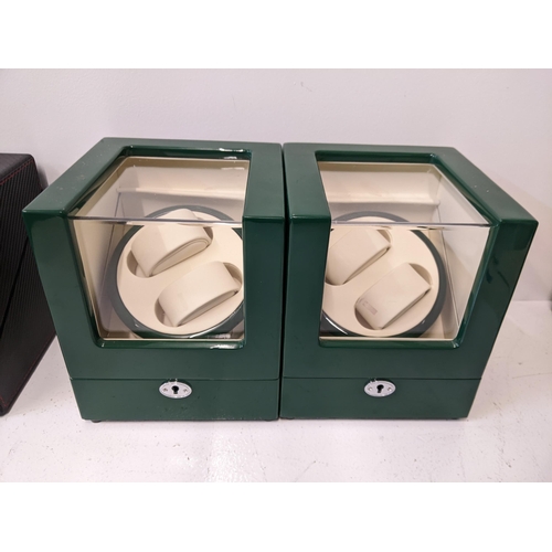 60 - Two watch display cases with a green lacquered finish with rotate and lighting options, without cabl... 