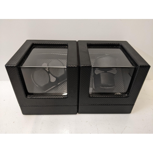 61 - Two watch display cases in black with rotate and lighting controls, with cable
Location: ram
If ther... 