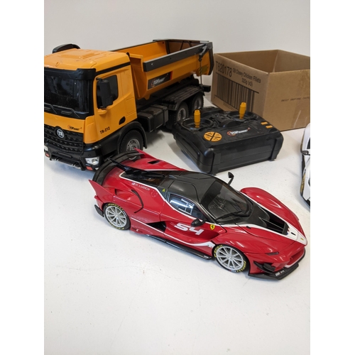 63 - A collection of model vehicles to include a remote control 'Top Race' TR212 tipper truck, a Masto 1/... 