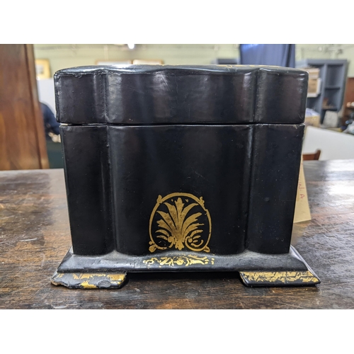 79 - A Victorian papier mache lidded tea caddy revealing a double lidded compartment, decorated with flor... 