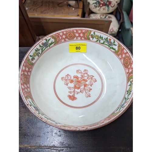 80 - A Japanese bowl and stand from the Meiji period decorated with Oriental plants and trees, 19cm dia, ... 