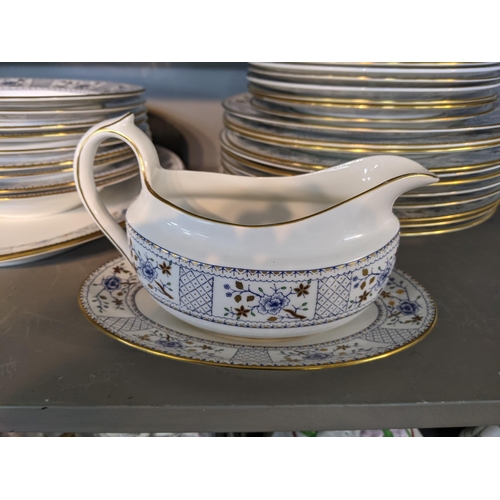 84 - A Royal Crown Derby Mandarin pattern part dinner service to include two lidded tureens, dinner plate... 