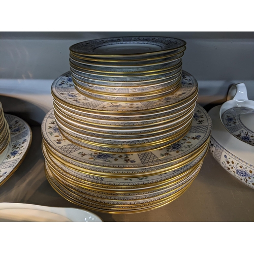 84 - A Royal Crown Derby Mandarin pattern part dinner service to include two lidded tureens, dinner plate... 